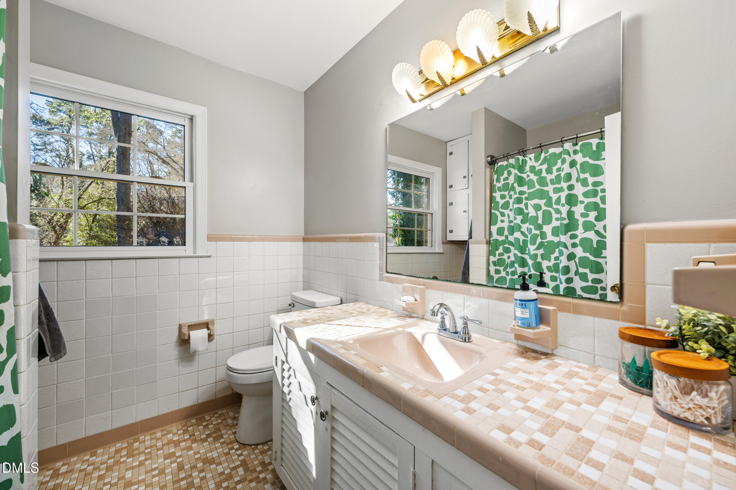 3726 Swift Drive Raleigh, NC 27606 - Photo 24 of 40 a bathroom with a granite countertop sink and a mirror