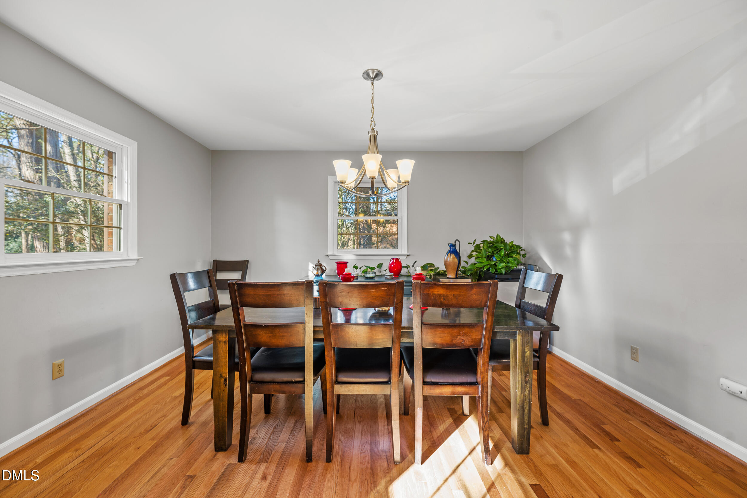 3726 Swift Drive Raleigh, NC 27606 - Photo 7 of 40 a view of a dining room with furniture window and wooden floor