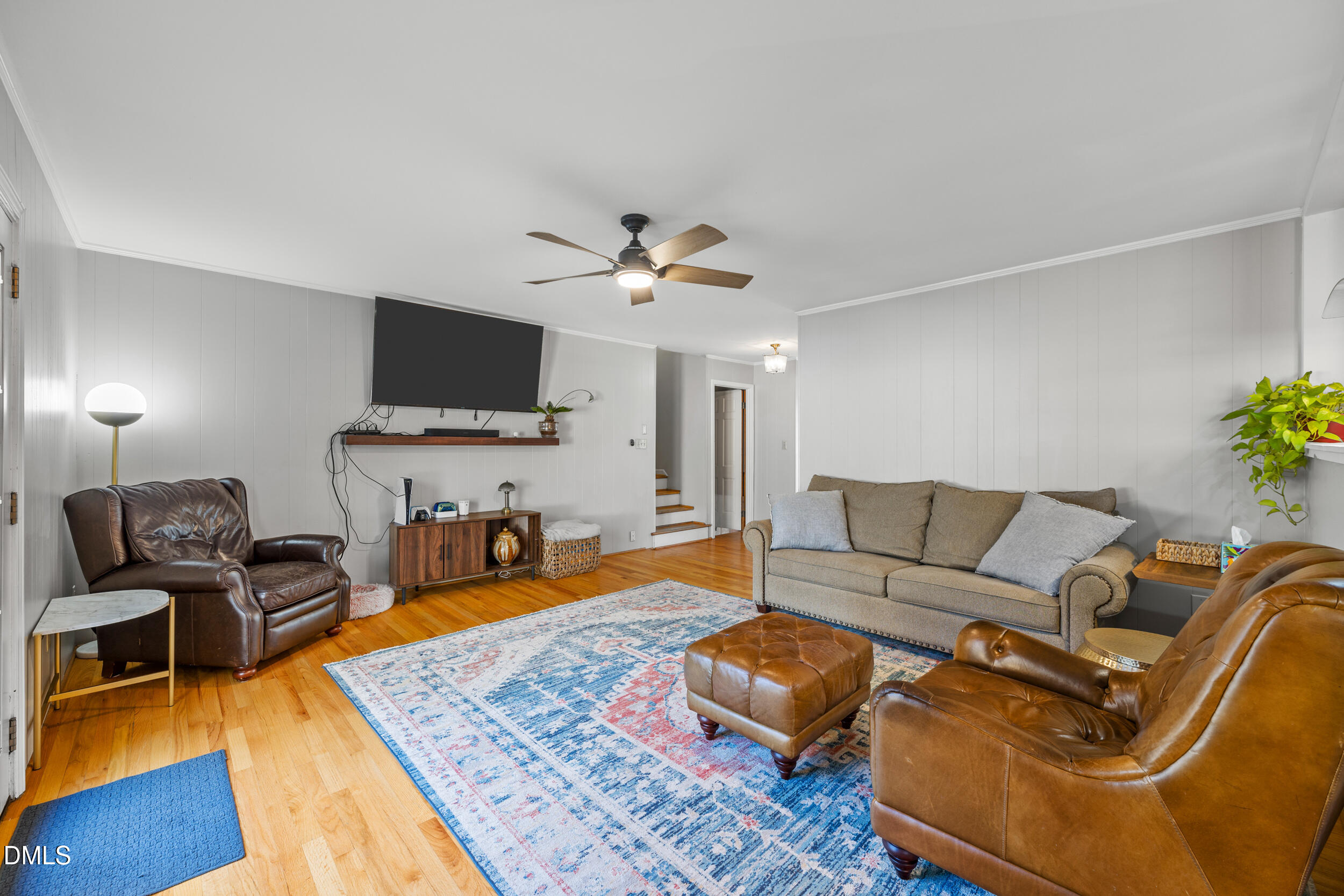 3726 Swift Drive Raleigh, NC 27606 - Photo 10 of 40 a living room with furniture and a flat screen tv