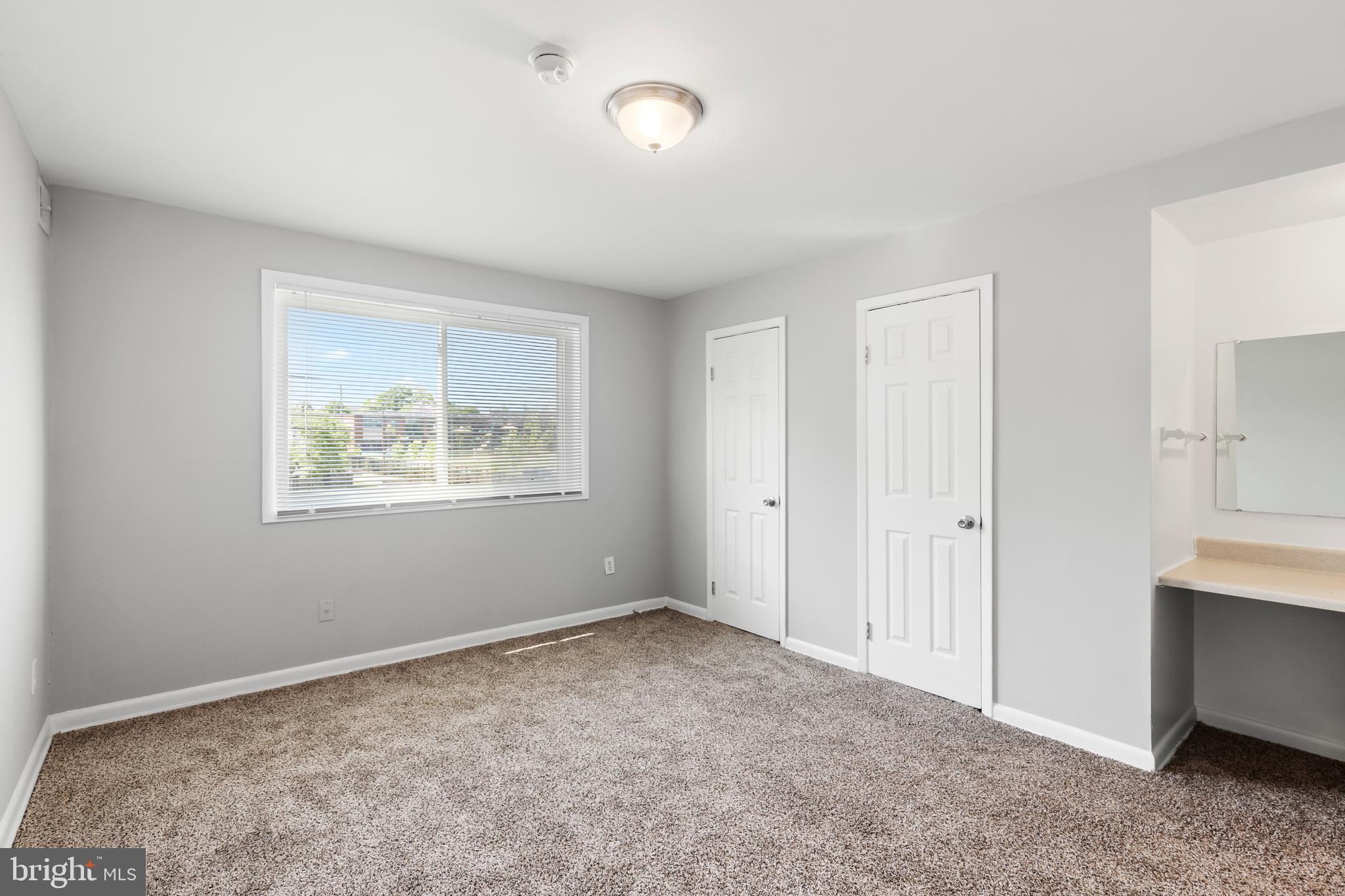 5340 C Street Southeast, Unit 301 Washington, DC 20019 - Photo 4 of 12 a view of an empty room with closet and a window