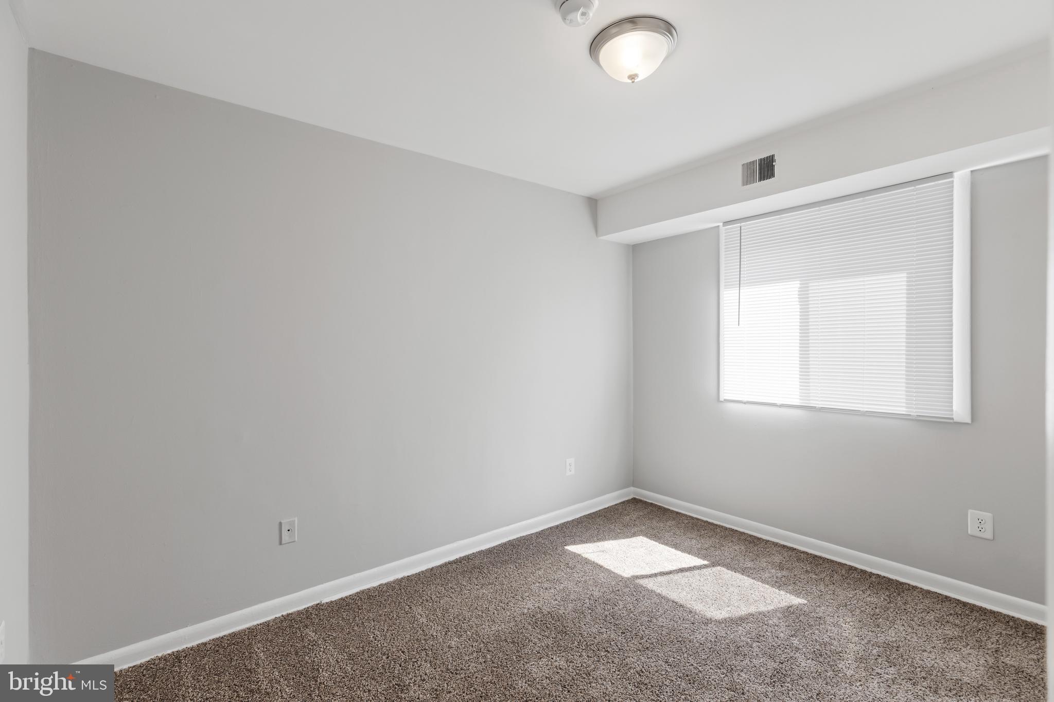 5340 C Street Southeast, Unit 301 Washington, DC 20019 - Photo 7 of 12 an empty room with a window