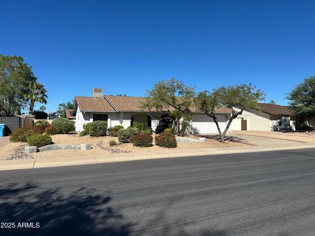 a view of a house with a snow on the road