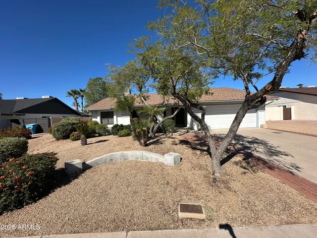 a view of a backyard with sitting area