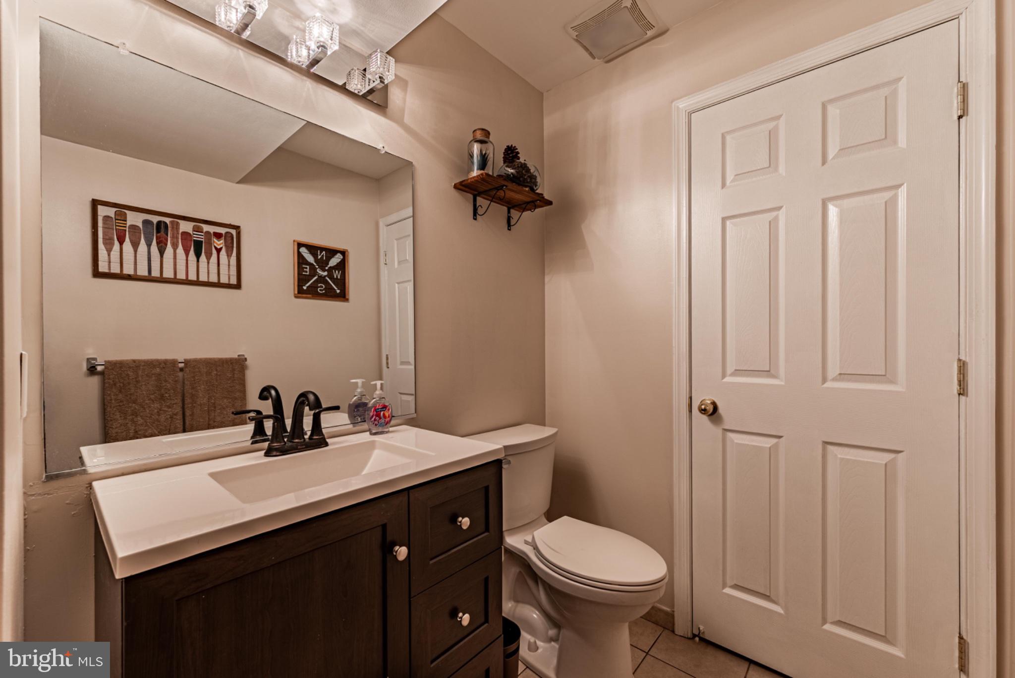 60 6 Point Court Baltimore, MD 21244 - Photo 21 of 28 a bathroom with a sink and a toilet