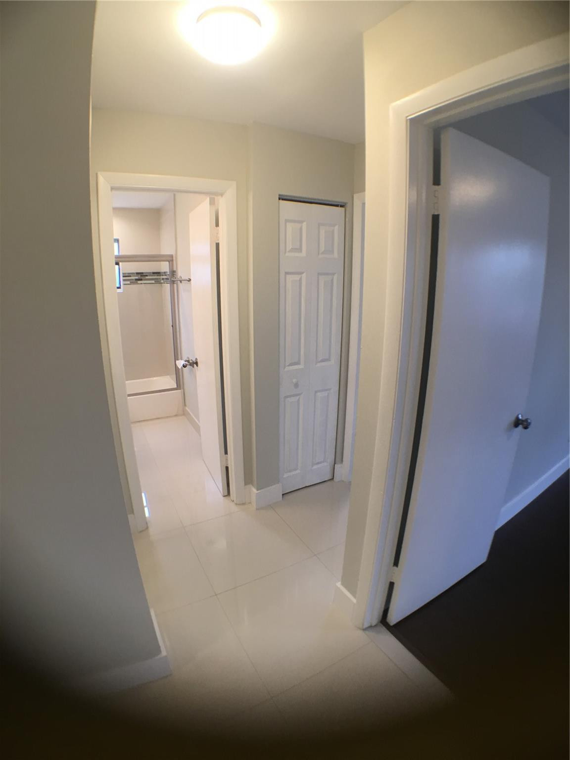 9713 Carousel Circle West Boca Raton, FL 33434 - Photo 33 of 59 a view of a hallway with closet and wooden floor