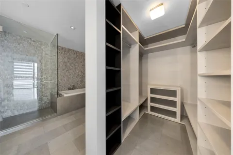 a view of closet area with empty racks