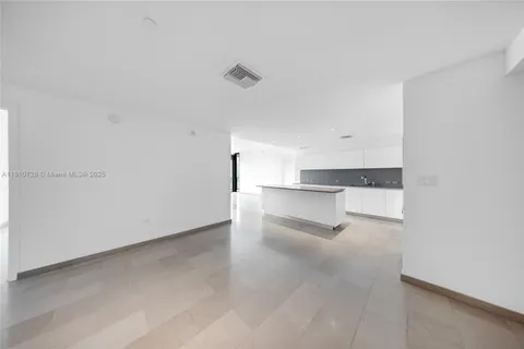 a view of a room with cabinet and mirrors