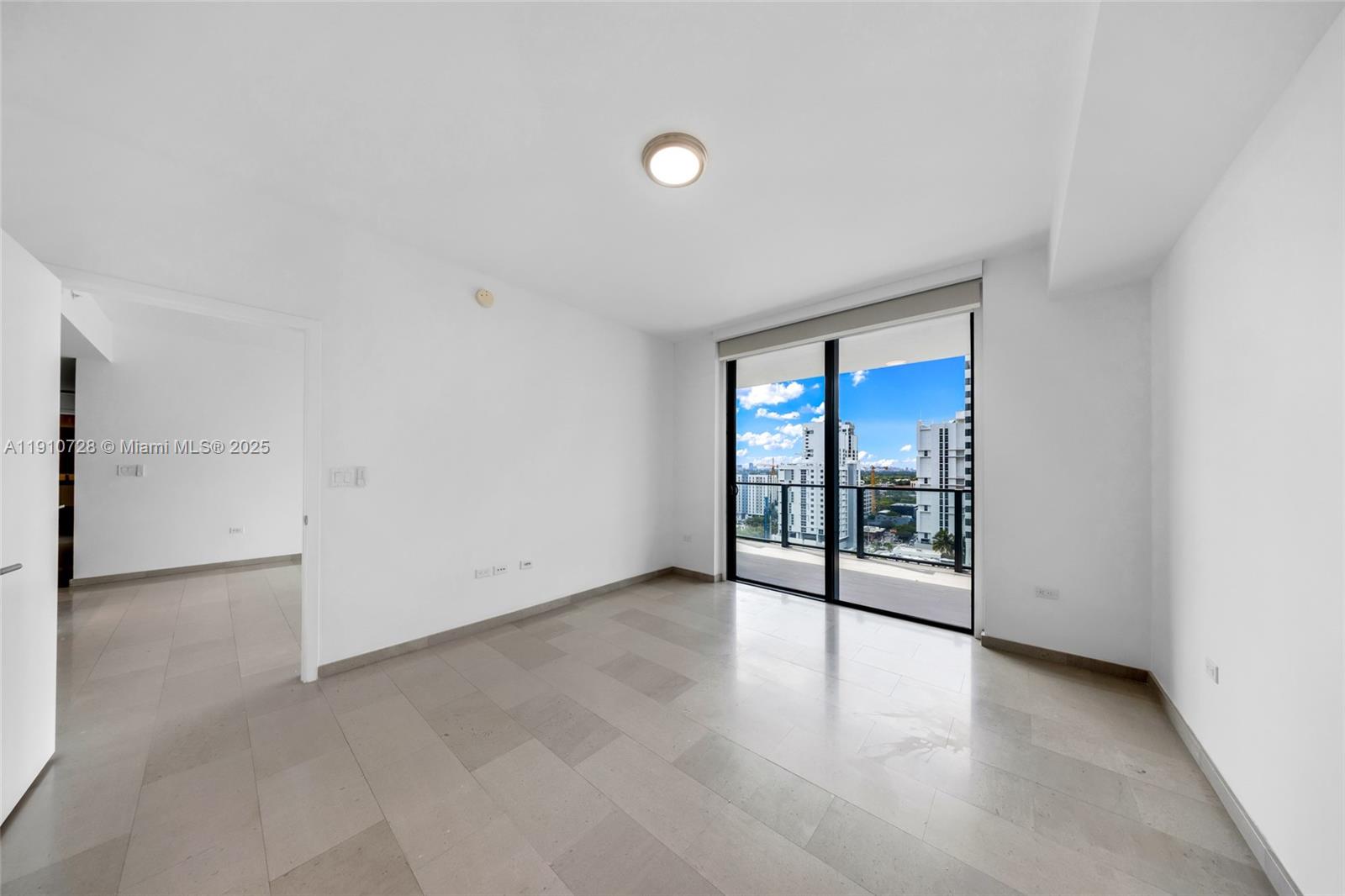 88 Southwest 7th Street, Unit 1004 Miami, FL 33130 - Photo 19 of 40 a view of an empty room with a window