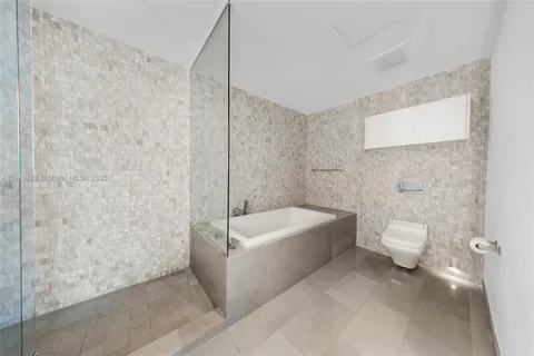 a bathroom with a sink a toilet and bathtub