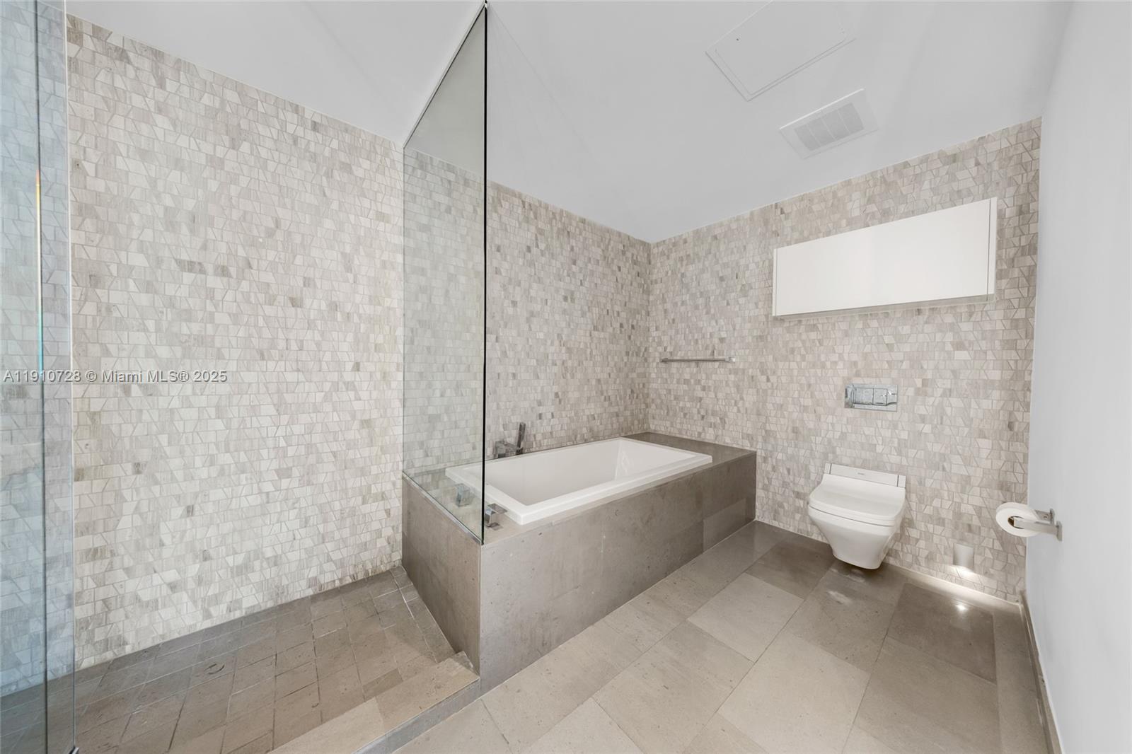 88 Southwest 7th Street, Unit 1004 Miami, FL 33130 - Photo 21 of 40 a bathroom with a sink a toilet and bathtub