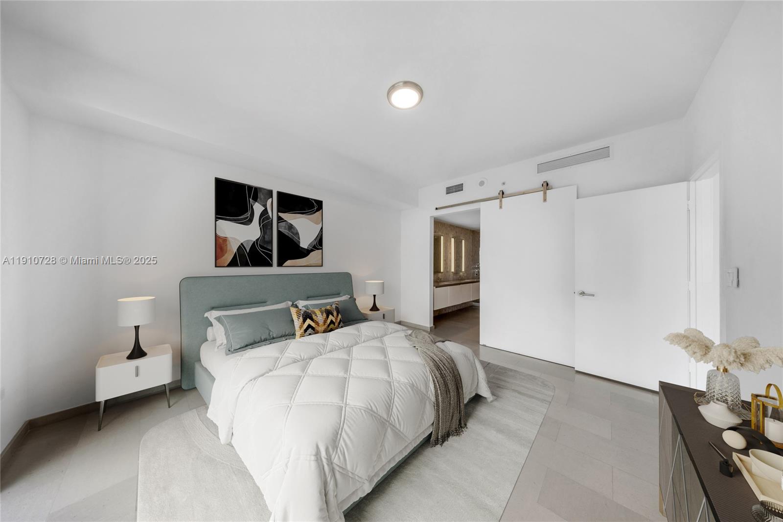 88 Southwest 7th Street, Unit 1004 Miami, FL 33130 - Photo 6 of 40 a bedroom with a bed and a night stand