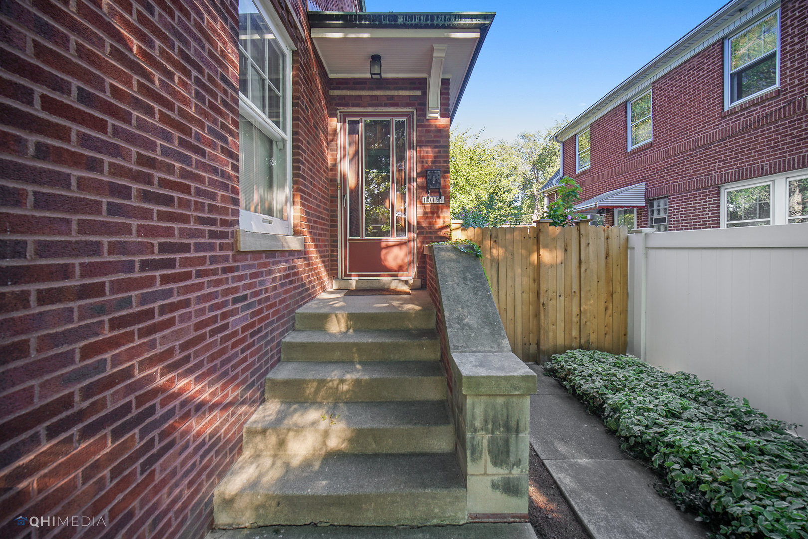 10151 South Bell Avenue Chicago, IL 60643 - Photo 2 of 22 a view of a brick house with many windows
