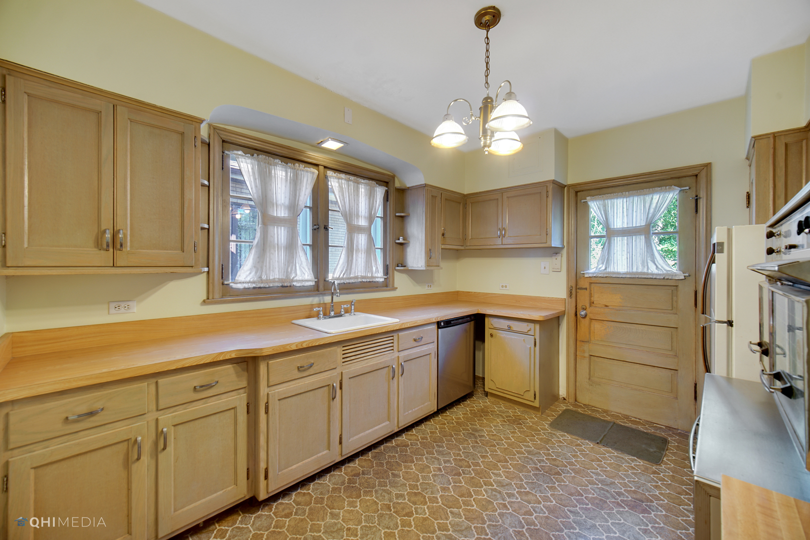 10151 South Bell Avenue Chicago, IL 60643 - Photo 7 of 22 a large kitchen with a large window stainless steel appliances and cabinets