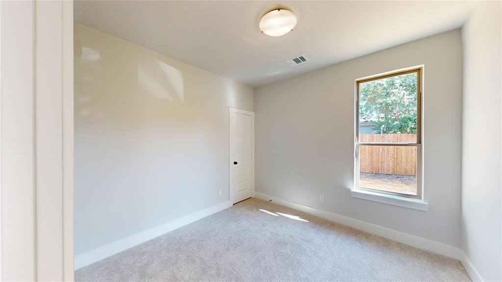 1609 Sharon Street Arlington, TX 76010 - Photo 12 of 29 an empty room with windows