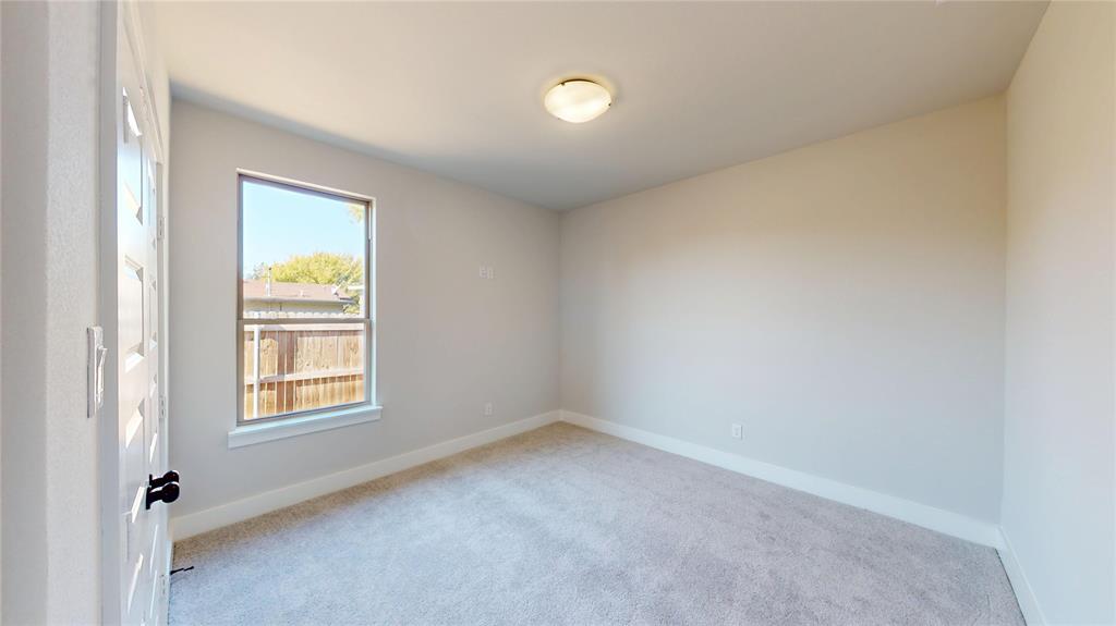 1609 Sharon Street Arlington, TX 76010 - Photo 15 of 29 an empty room with windows