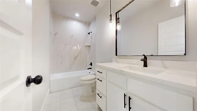 a bathroom with a sink toilet and mirror