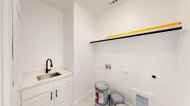 a view of a hallway with wooden floor and a bathroom
