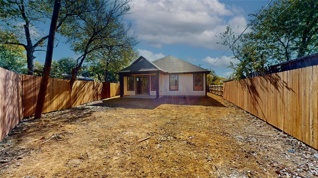 1609 Sharon Street Arlington, TX 76010 - Photo 27 of 29 a view of a house with wooden fence