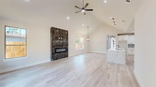 a kitchen that has a sink a stove and a window