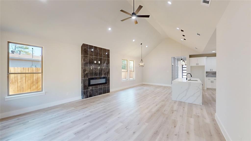 1609 Sharon Street Arlington, TX 76010 - Photo 7 of 29 wooden floor in an empty room with a window