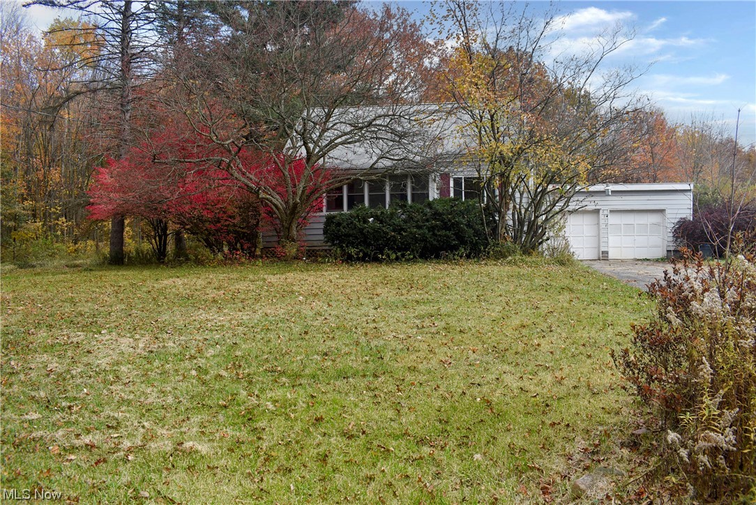 8718 Freedom Road Windham, OH 44288 - Photo 1 of 20 View of yard with a garage