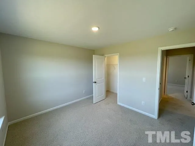 an empty room with a bathroom