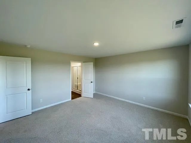 an empty room with a empty space and window