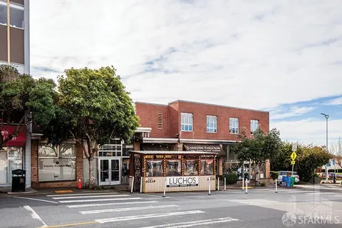 a view of a building and a street