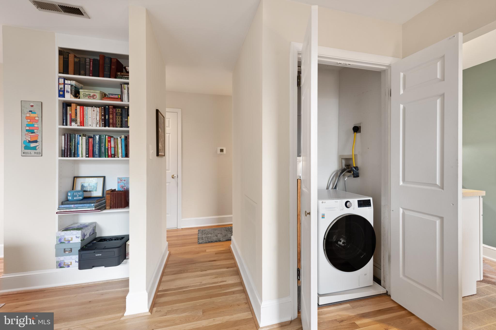 317 10th Street Northeast, Unit 13 Washington, DC 20002 - Photo 18 of 29 a view of a hallway with a washer and dryer