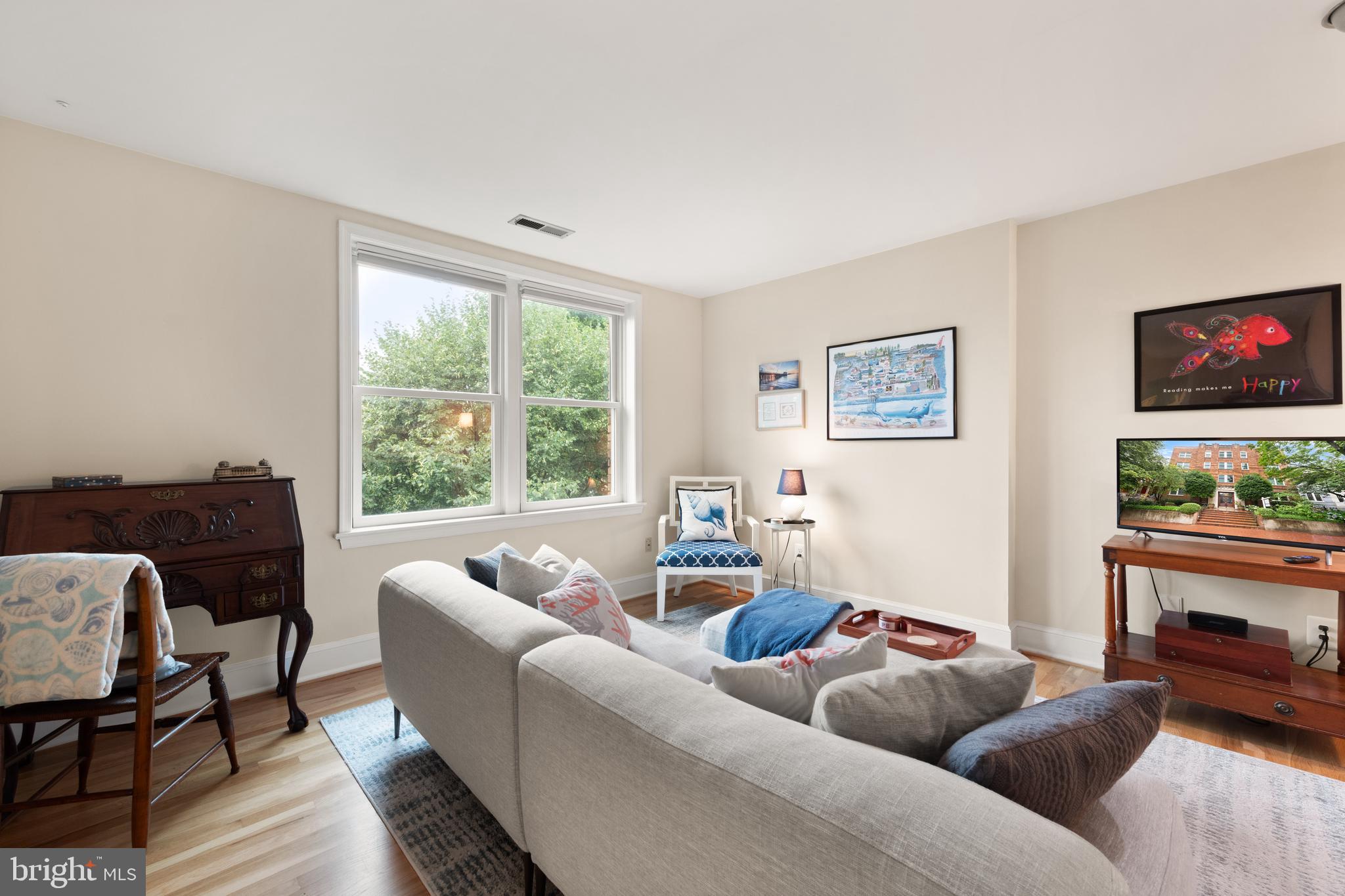317 10th Street Northeast, Unit 13 Washington, DC 20002 - Photo 9 of 29 a living room with furniture and a flat screen tv