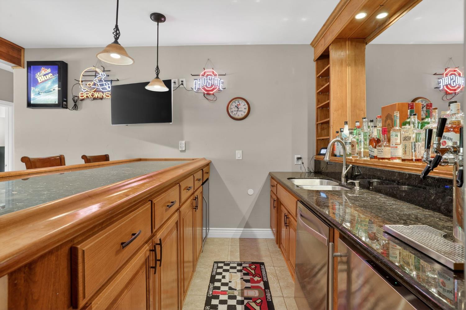 4554 Cross Creek Road Cool, CA 95614 - Photo 52 of 92 a kitchen with stainless steel appliances granite countertop a sink a stove and a wooden floor