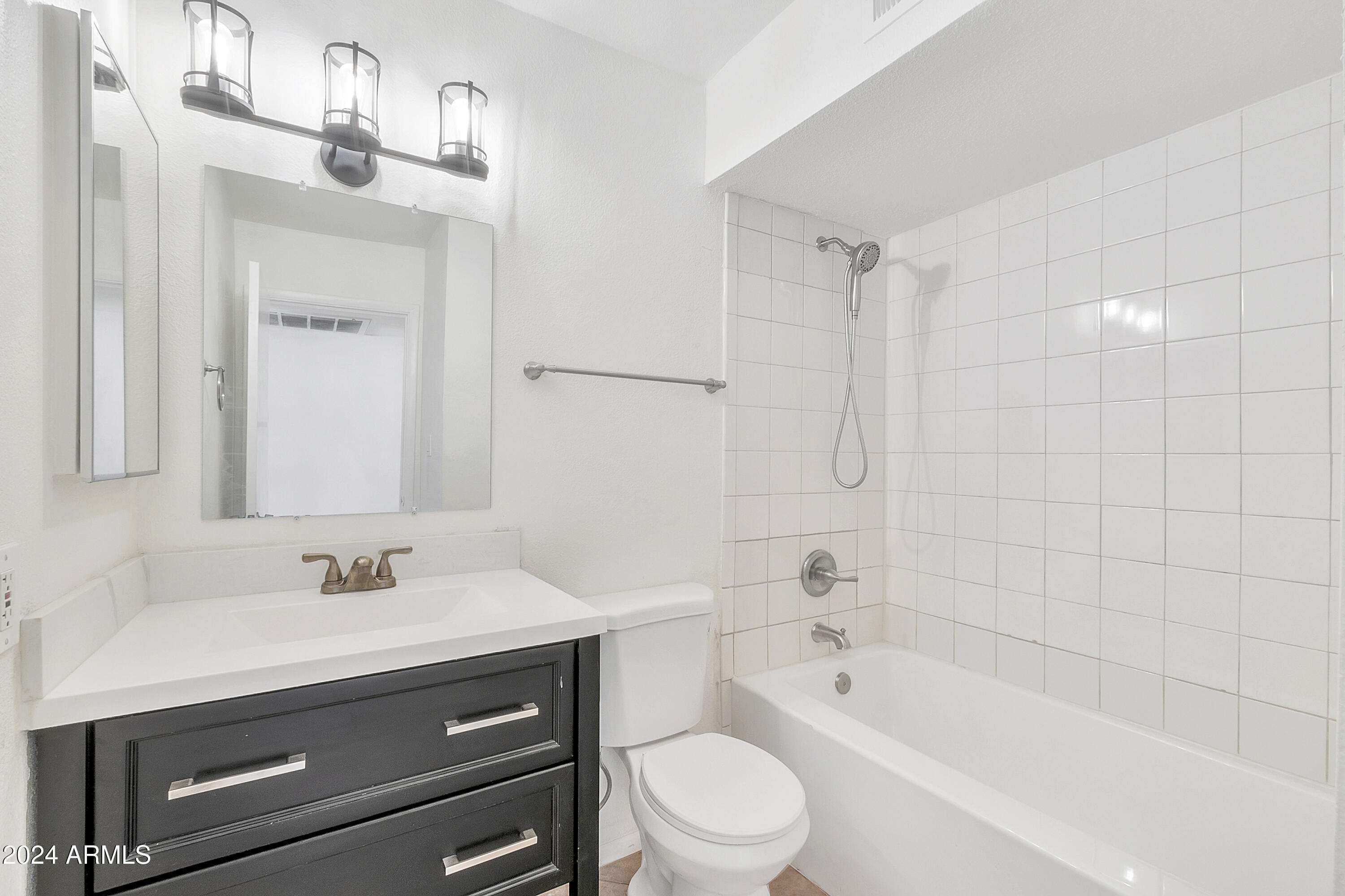 5234 East Blanche Drive Scottsdale, AZ 85254 - Photo 13 of 20 a bathroom with a sink a toilet a mirror and shower