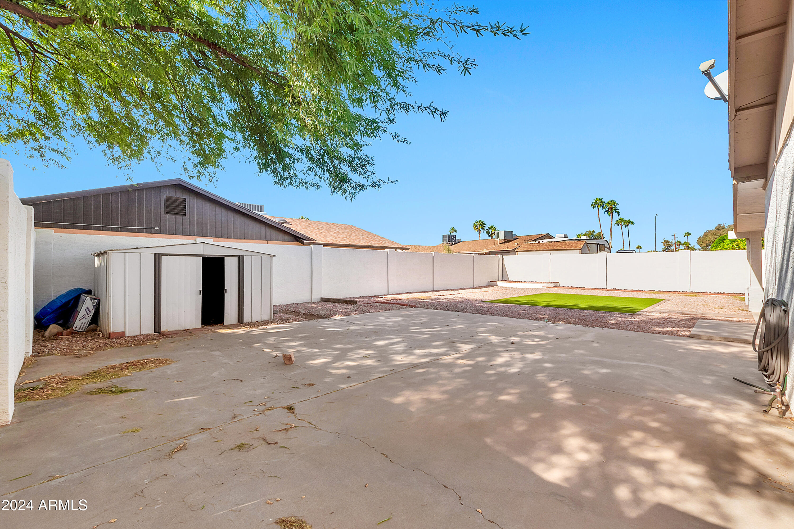 5234 East Blanche Drive Scottsdale, AZ 85254 - Photo 16 of 20 a view of a white house with a yard and large tree