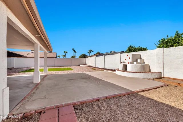 a view of a swimming pool with a yard