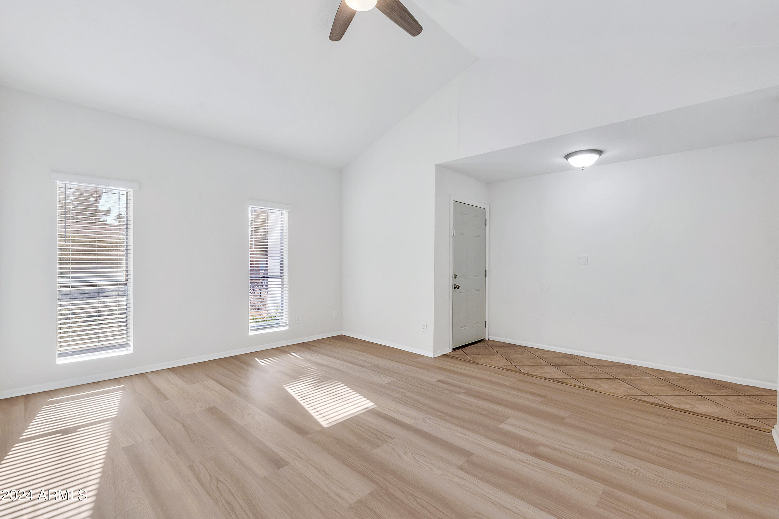 5234 East Blanche Drive Scottsdale, AZ 85254 - Photo 2 of 20 wooden floor in an empty room with a window