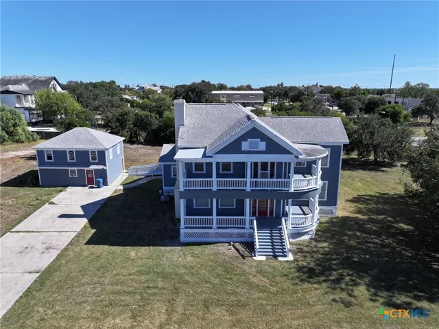 an aerial view of a house with a garden
