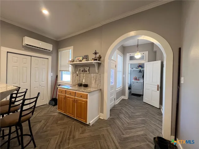 a kitchen with a stove and a refrigerator