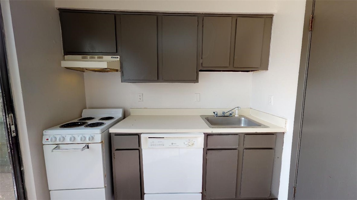 725 Peppertree Drive, Unit 30 Bryan, TX 77801 - Photo 7 of 14 a utility room with sink dryer and washer