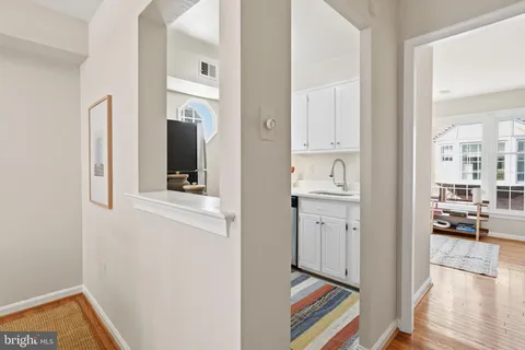 a kitchen with stainless steel appliances granite countertop a sink and a stove