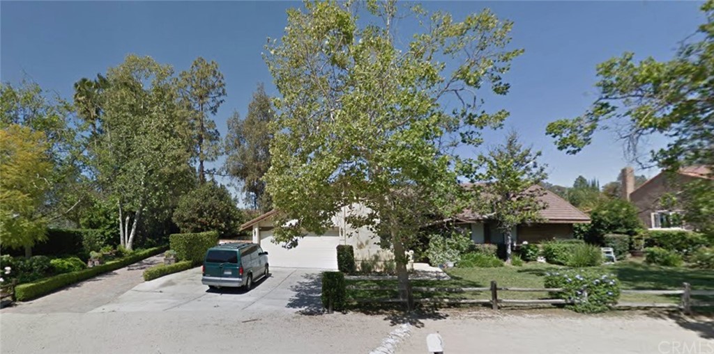 73 Wrangler Road Simi Valley, CA 93065 - Photo 1 of 1 an outdoor space with plants and trees