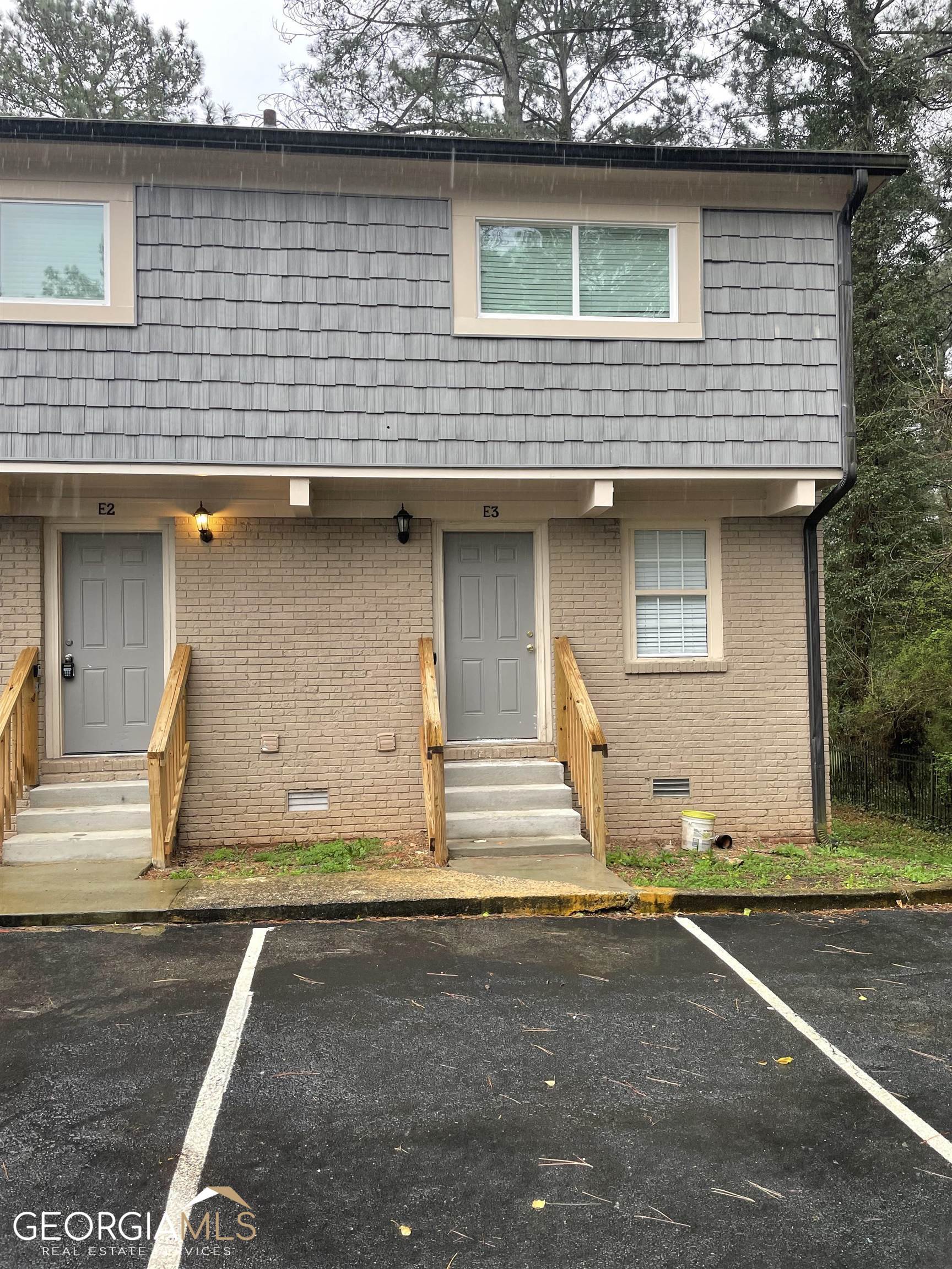 a front view of a house with garage