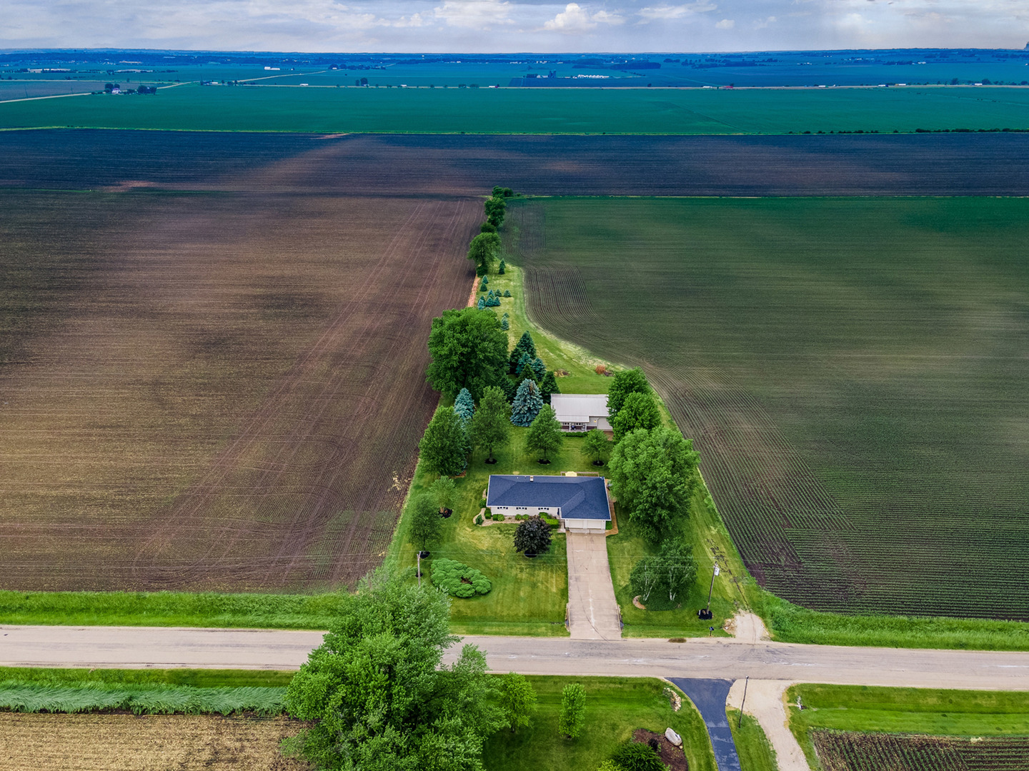 4496 South Mulford Road Rochelle, IL 61068 - Photo 12 of 52 a view of a garden with a lake