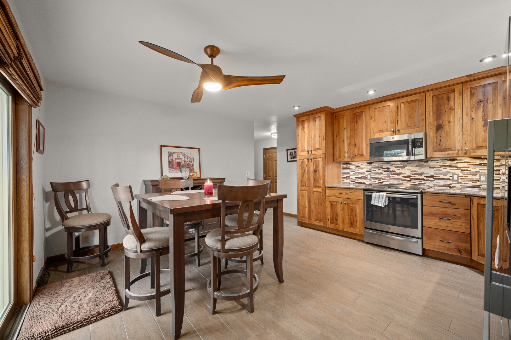 4496 South Mulford Road Rochelle, IL 61068 - Photo 25 of 52 a view of a kitchen with a table and chairs