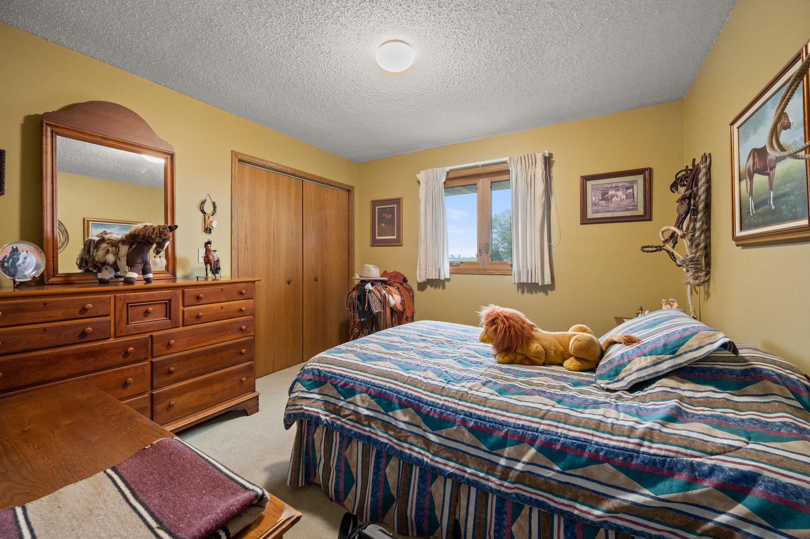 4496 South Mulford Road Rochelle, IL 61068 - Photo 38 of 52 a bedroom with a bed and a dresser in it