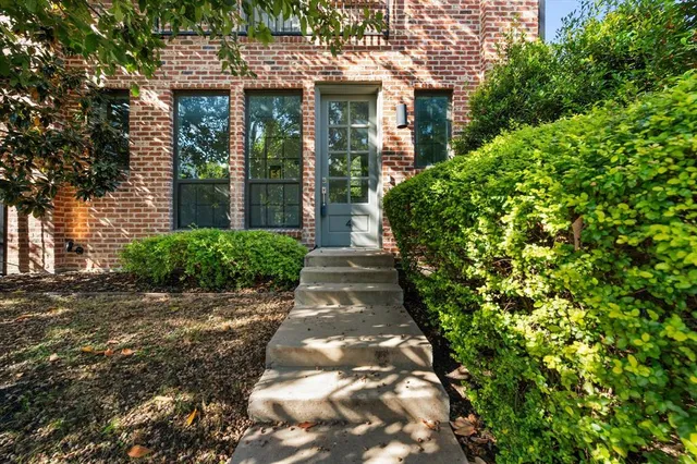 a view of a pathway with a garden