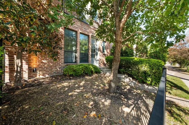 a view of a house with a tree