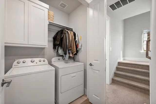 a view of storage and utility room with washer and dryer