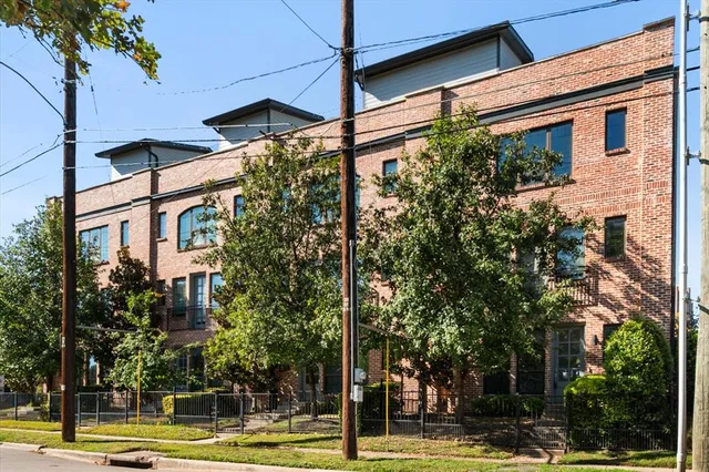 a view of a building with a tree