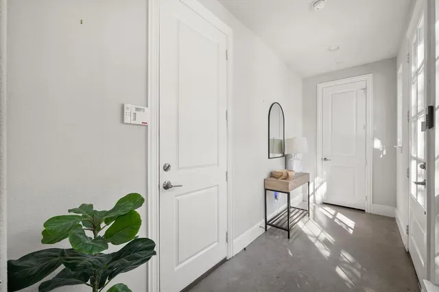 a view of an entryway with wooden floor