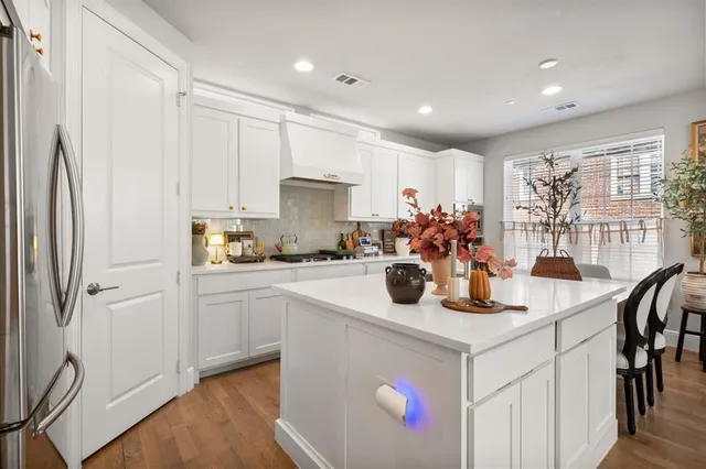 a kitchen with a sink appliances and cabinets